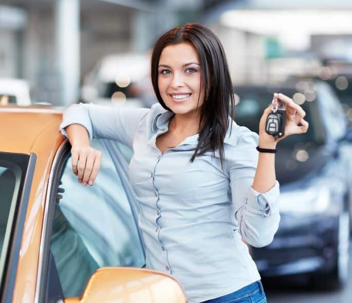 Lady Holding a Car Key - Best Travel Deals